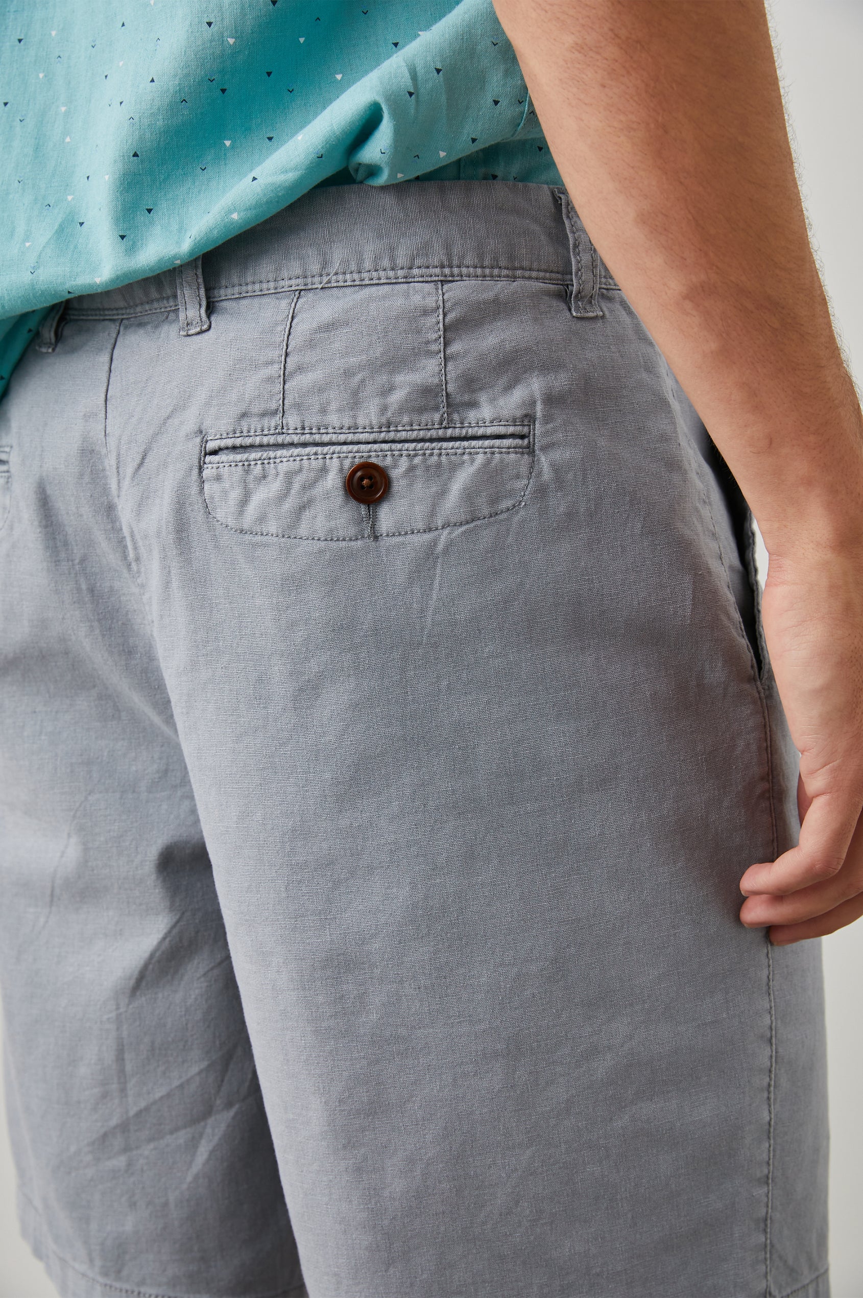 Boden Knee-Length Shorts with Belt Loops, Two Front Pockets and Two Back Button Welt Pockets in Gravel Colorway - Back View Featured on Model