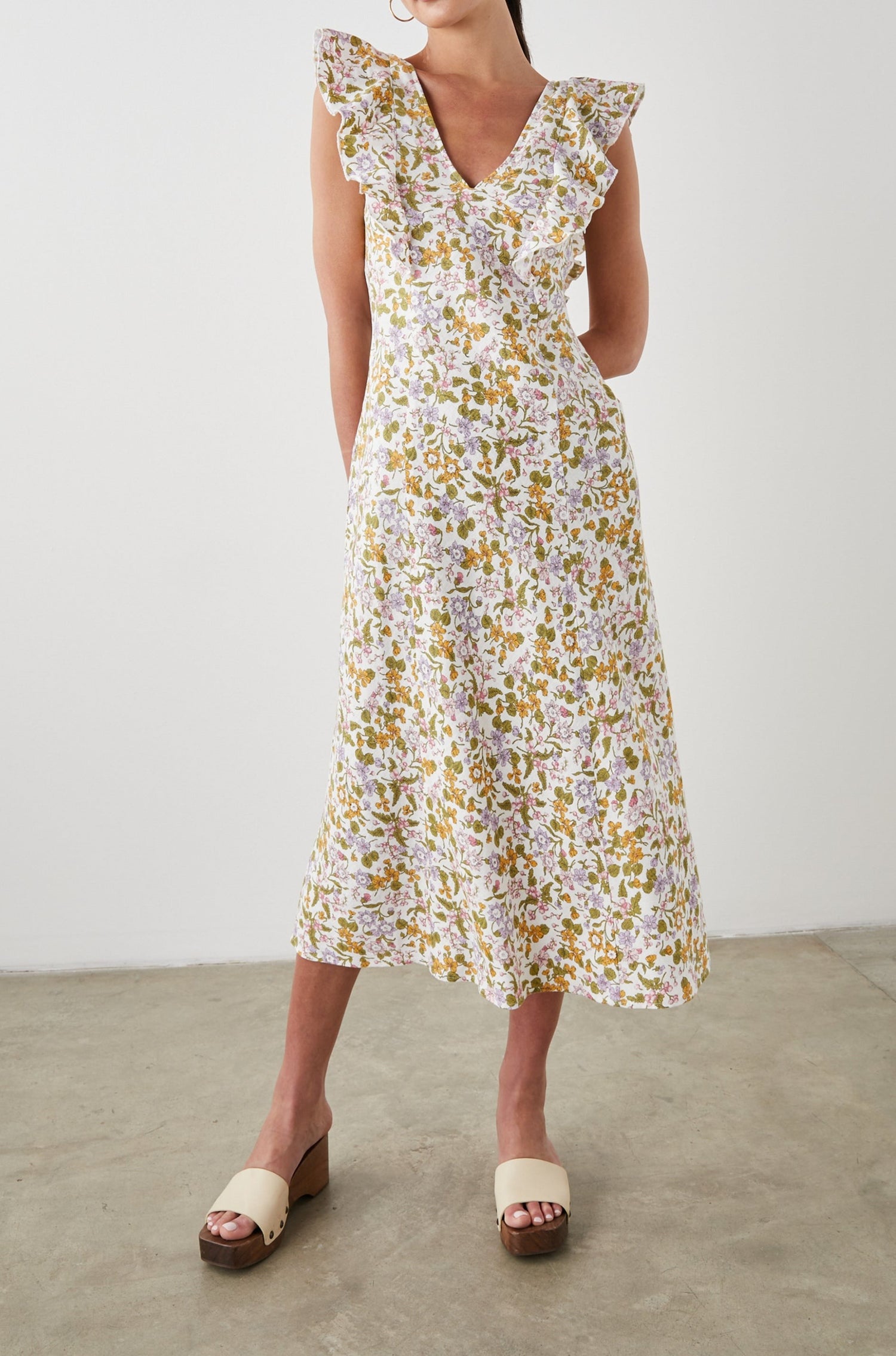 Constance Short Sleeve Midi Dress with Flutter Sleeves, a V Neck, and Cross Ties Across the Mid to Upper Back in Tansy Colorway, Brown, Orange, Purple, Pink and Green on White - Front Full Body View Featured on Model 