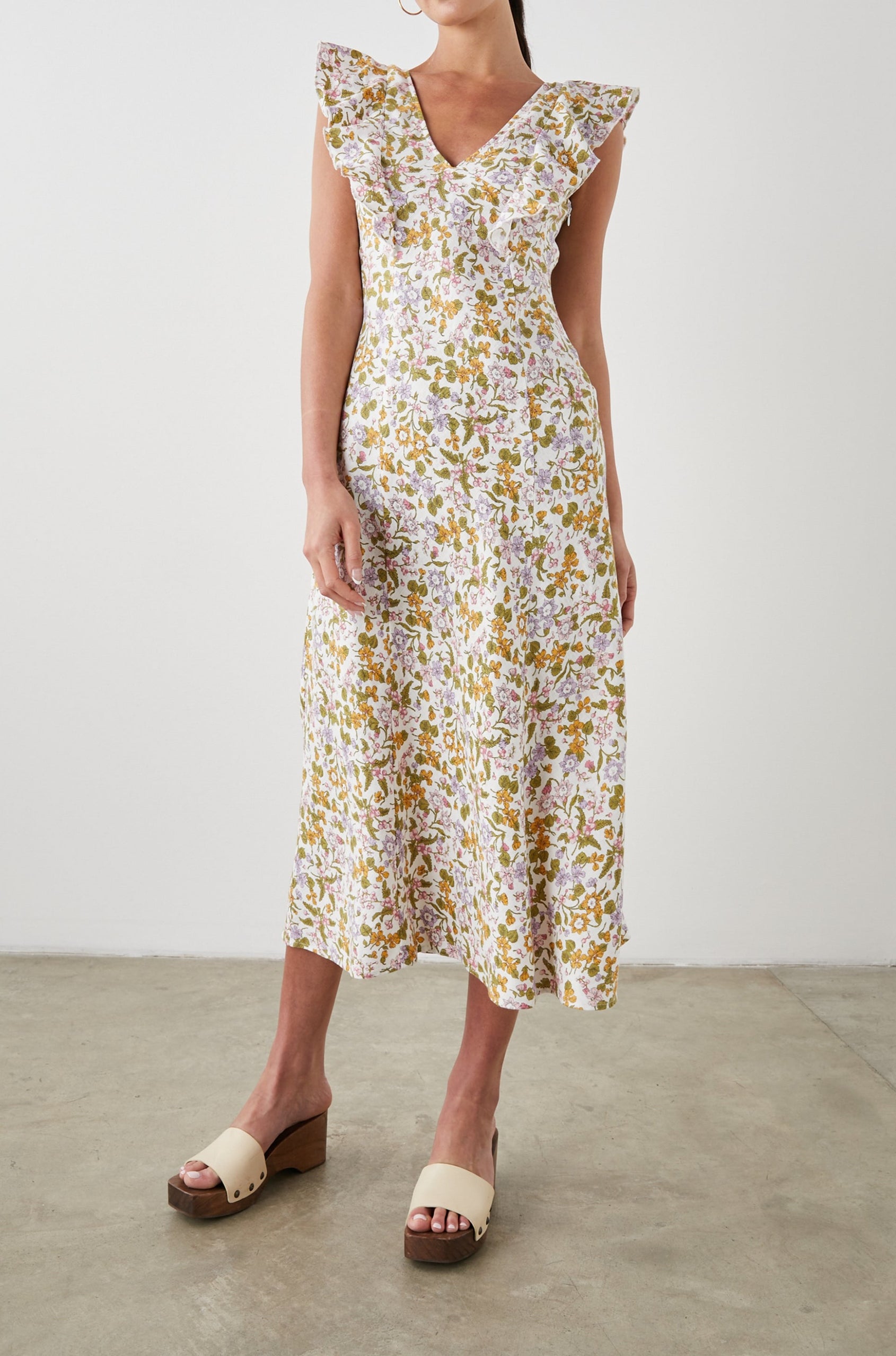 Constance Short Sleeve Midi Dress with Flutter Sleeves, a V Neck, and Cross Ties Across the Mid to Upper Back in Tansy Colorway, Brown, Orange, Purple, Pink and Green on White - Front Full Body View Featured on Model 