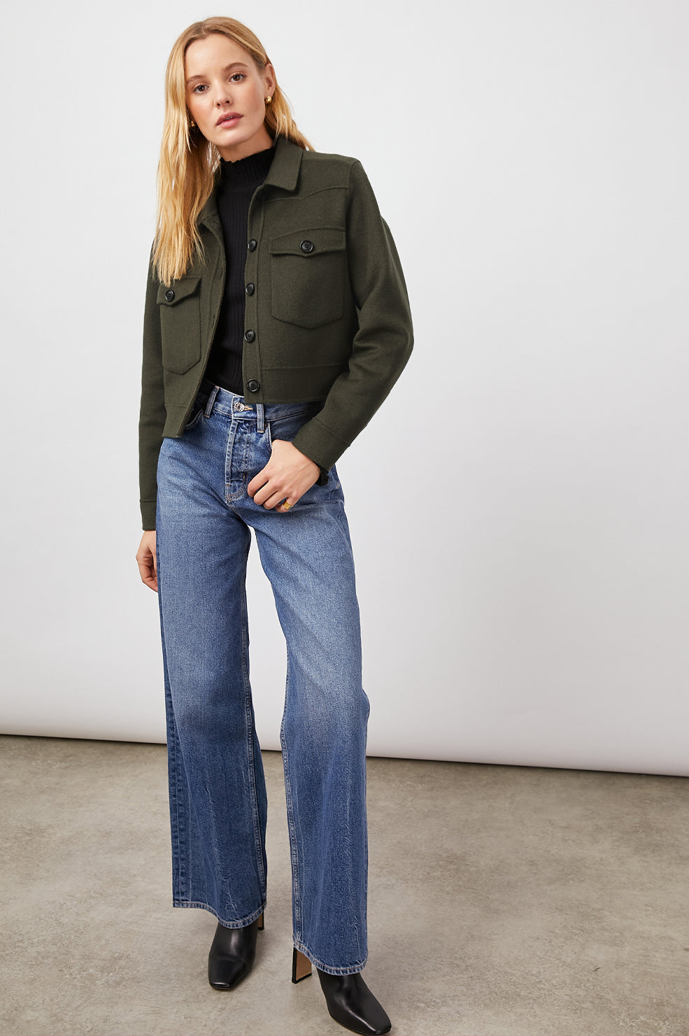 Easton Slightly Cropped Jacket with Button Closure, Two Chest Button Flap Pockets and Western Yokes in Olive Colorway - Front Full Body View Featured on Model