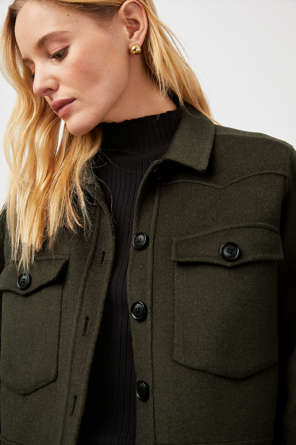 Easton Slightly Cropped Jacket with Button Closure, Two Chest Button Flap Pockets and Western Yokes in Olive Colorway - Front View Featured on Model