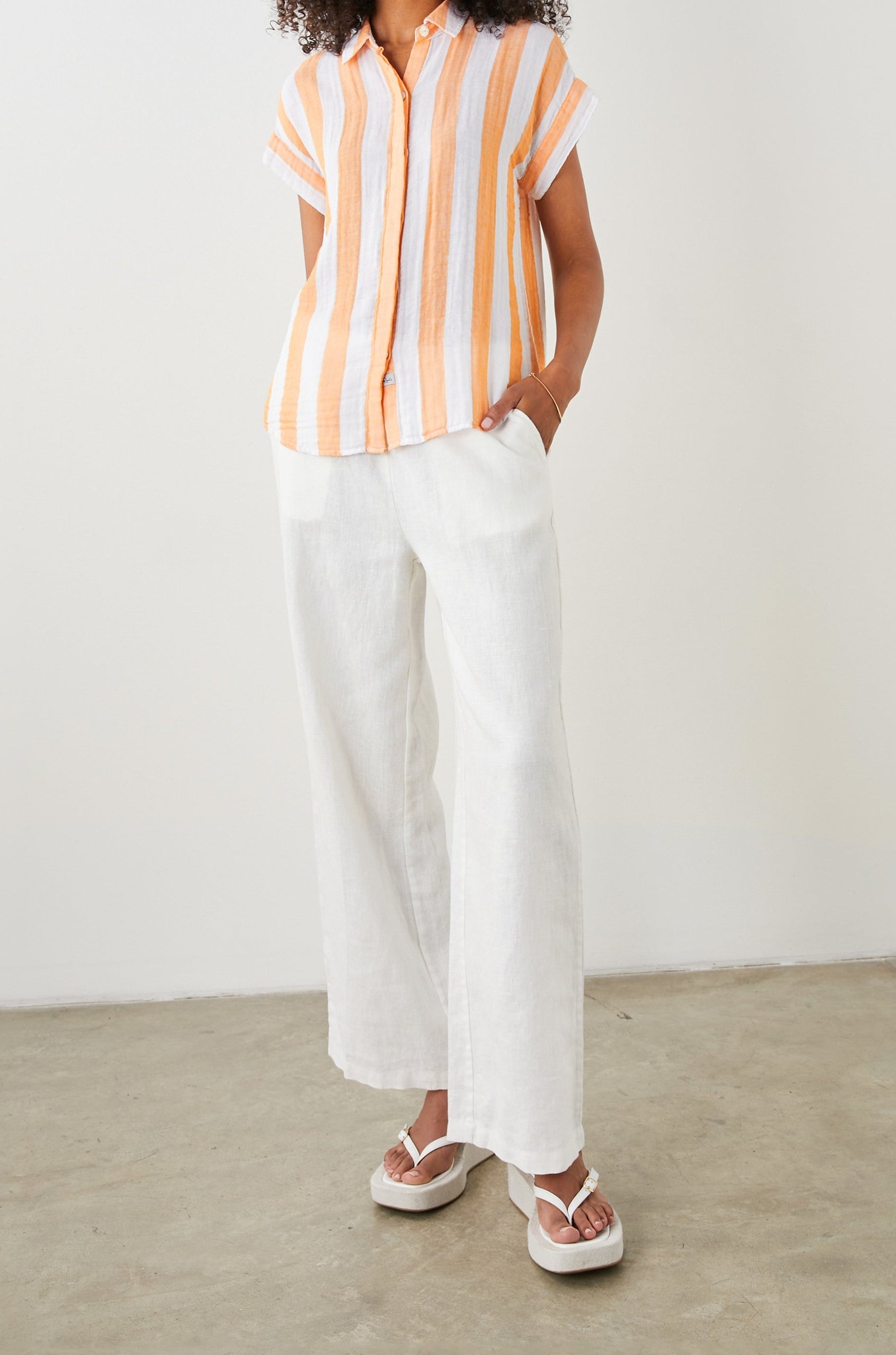 Jamie Short Sleeve Button Up in Ortona Stripe Colorway, Orange and White Vertical Stripes - Front Full Body View Featured on Model 