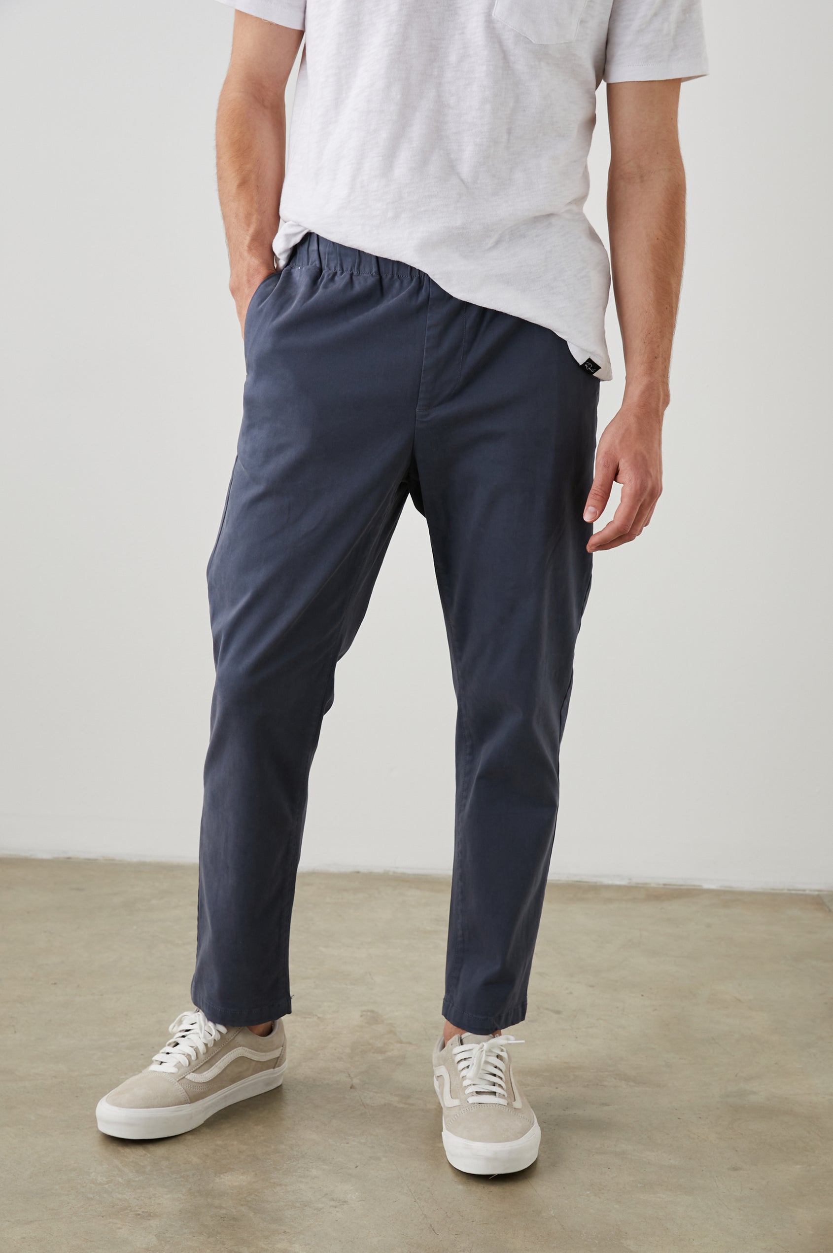  Julian Pants with an Elastic Waist, Two Front Pockets and Two Back Welt Pockets in Faded Blue Colorway - Front View Featured on Model 
