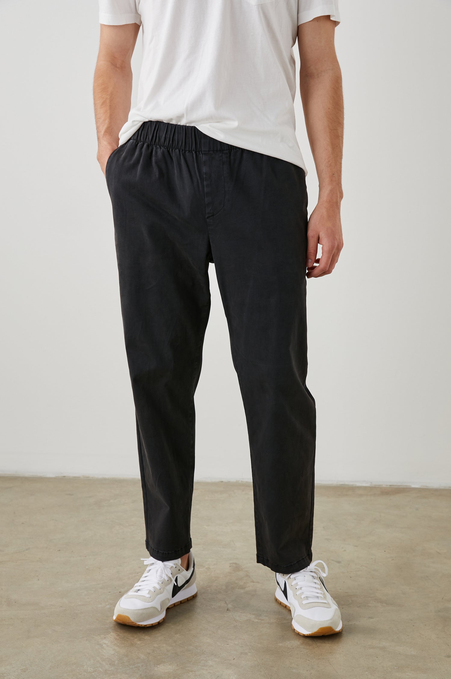  Julian Pants with an Elastic Waist, Two Front Pockets and Two Back Welt Pockets in Washed Black Colorway - Front View Featured on Model 