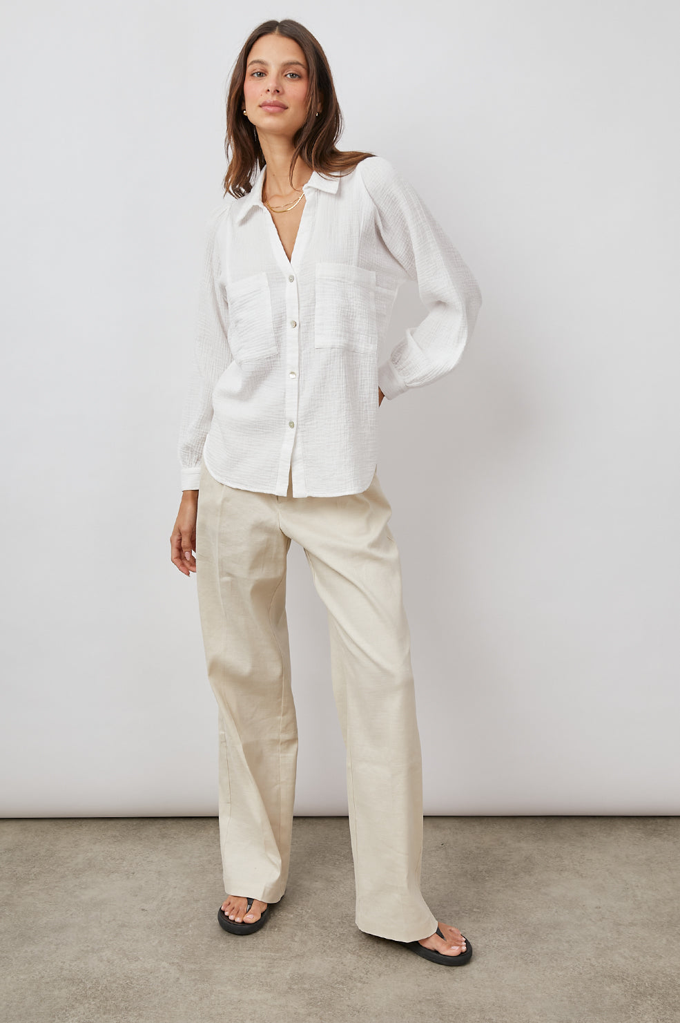 Lauren Long-Sleeve Button Up with Two Chest Patch Pockets and a V Neck in White Colorway - Front Full Body View Featured on Model