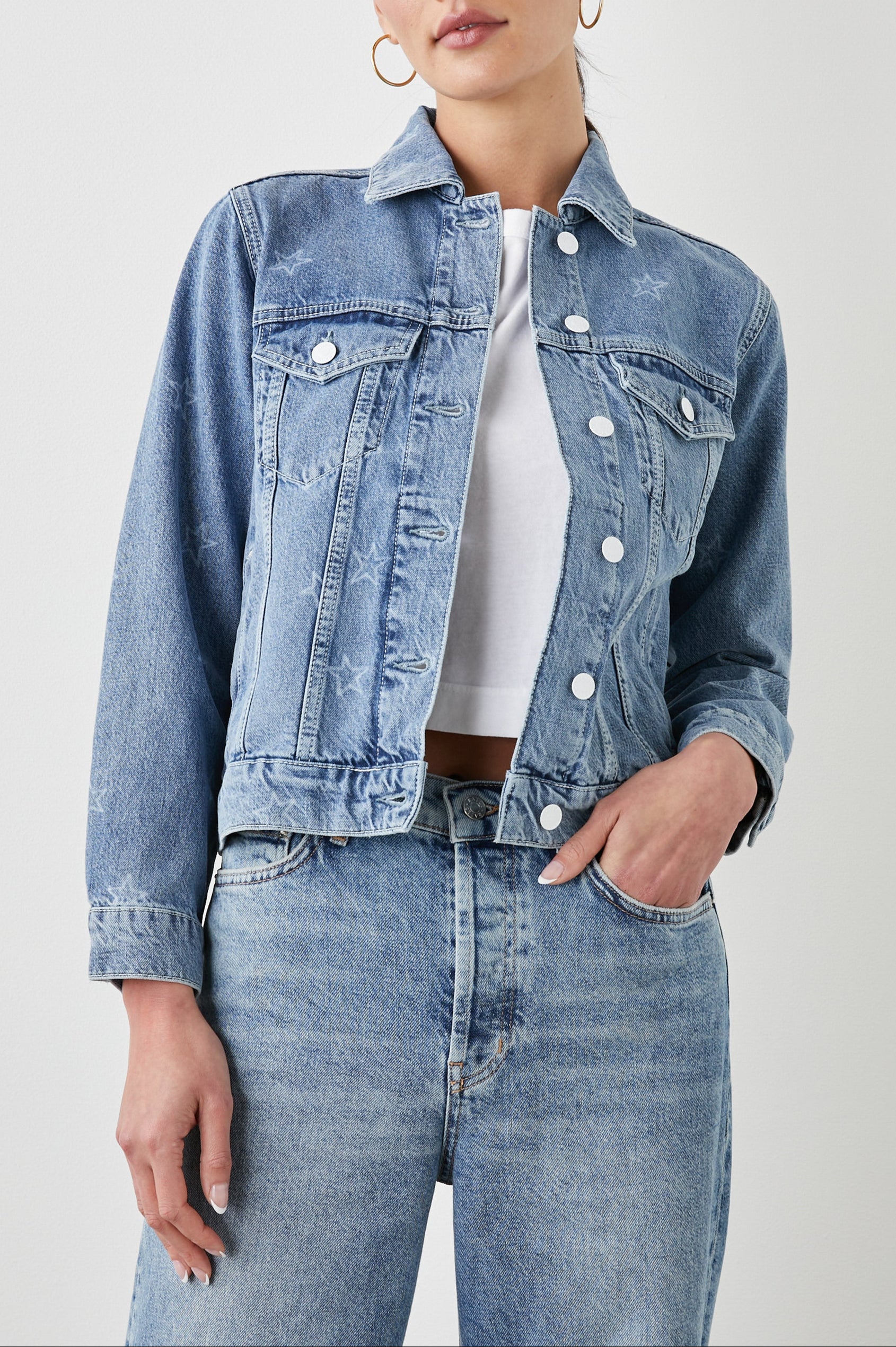 Mulholland Denim Jacket with Button Closure, Two Chest Button Flap Pockets, Two Front Pockets, Adjustable Button Straps on Hem in Lady Liberty Colorway, with White Stars - Front View Featured on Model  