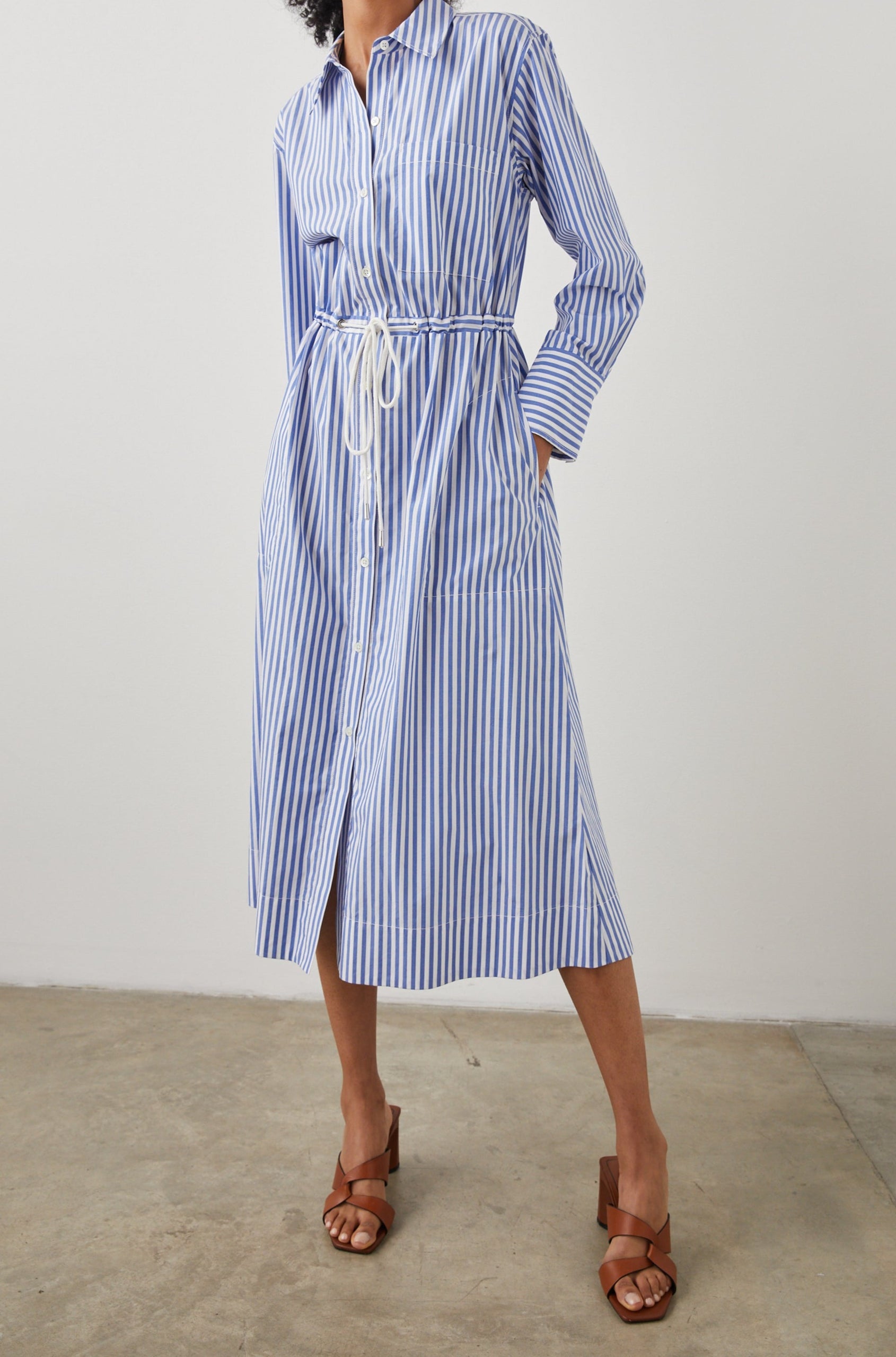 Shivonne Long-Sleeve Midi Dress with a Full Button Front, a Collar and a Drawcord Waist in Rivera Stripe Colorway, Blue and White Vertical Stripes - Front Full Body View Featured on Model