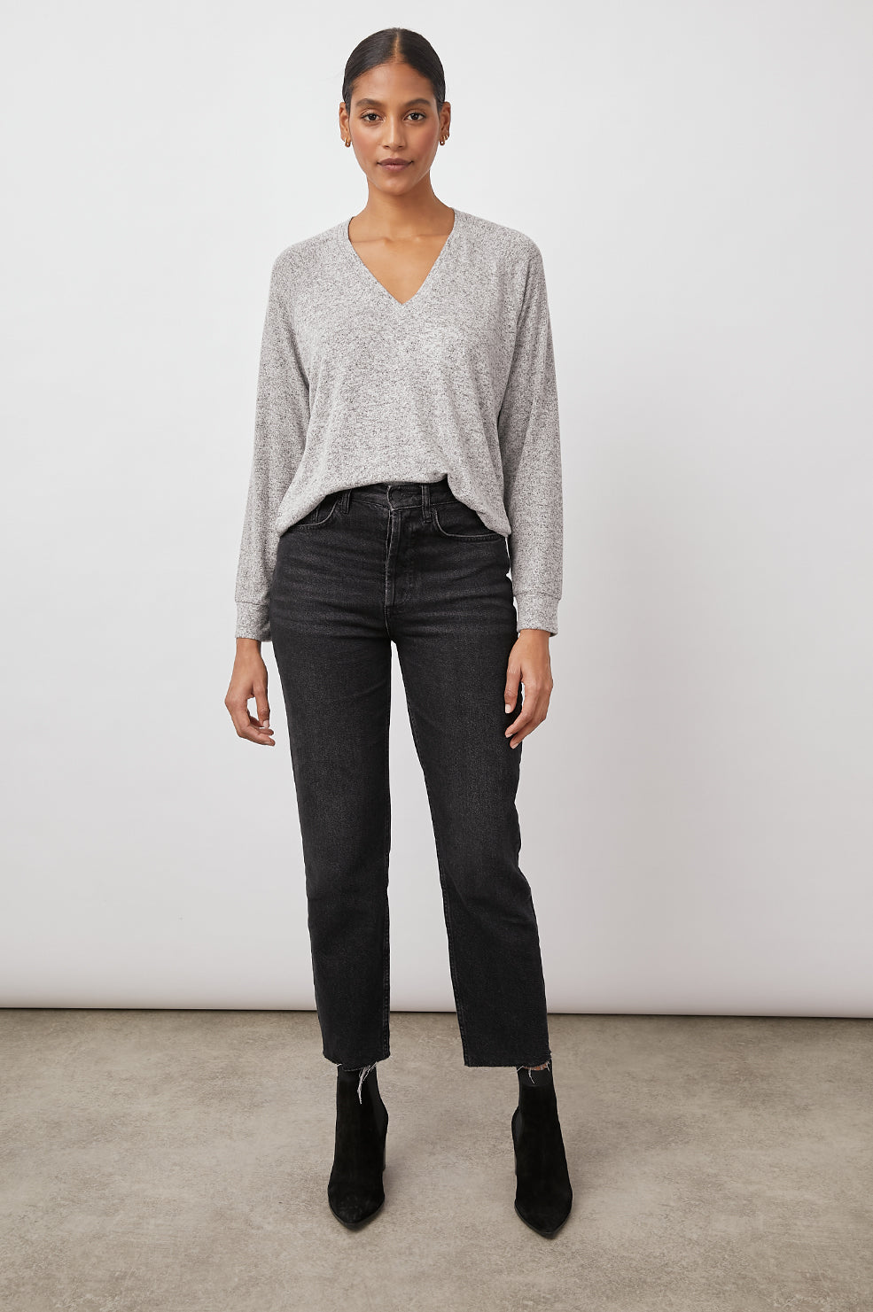 Thalia Long-Sleeve T-Shirt with a V Neck and a High Low Hem in Melange Grey Colorway - Front Full Body View Featured on Model 